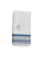 Completo asciugamani viso e ospite in cotone fantasia ZigZag con sfondo bianco